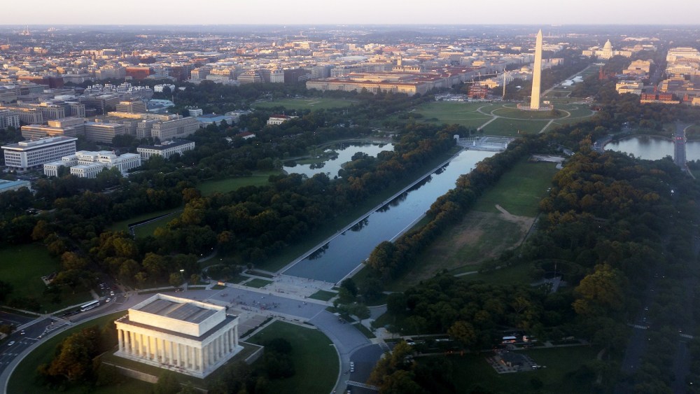 The skyline of Washington, D.C., including the Lincoln Memorial, Washington Monument, US Capitol and National Mall, is seen from the air at sunset in this photograph taken on June 15, 2014. (Photo by Saul Loeb/AFP/Getty)