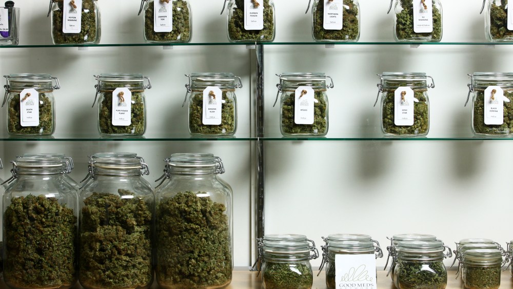 Jars of medical cannabis line the shelves inside a Good Meds medical cannabis center in Lakewood, Colo., U.S., on Monday, March 4, 2013. (Photo by Matthew Staver/For The Washington Post/Getty)