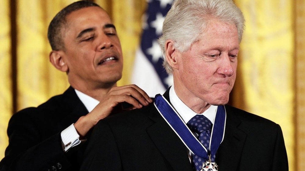 U.S. President Barack Obama awards the Medal of Freedom to former U.S. President Bill Clinton at the White House, Nov. 20, 2013.