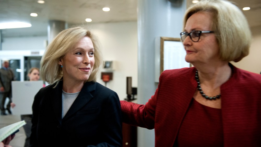 Senators Kristen Gillibrand (D-NY) and  Claire McCaskill (D-MO) talk with reporters at the U.S. Capitol on Nov. 20, 2013.