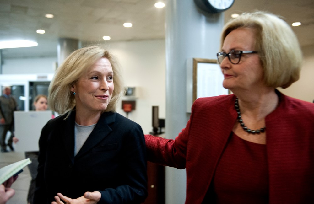 Senators Kristen Gillibrand (D-NY) and Claire McCaskill (D-MO) talk with reporters at the U.S. Capitol on Nov. 20, 2013.