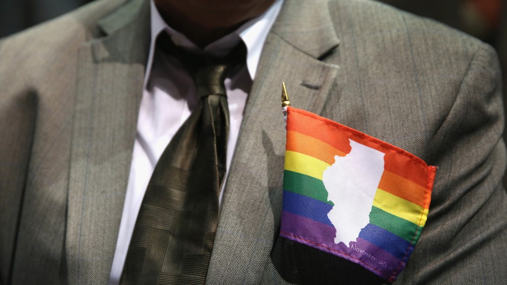 A supporter of gay marriage wears an Illinois gay pride flag on his jacket on Nov. 20, 2013 in Chicago, Ill.