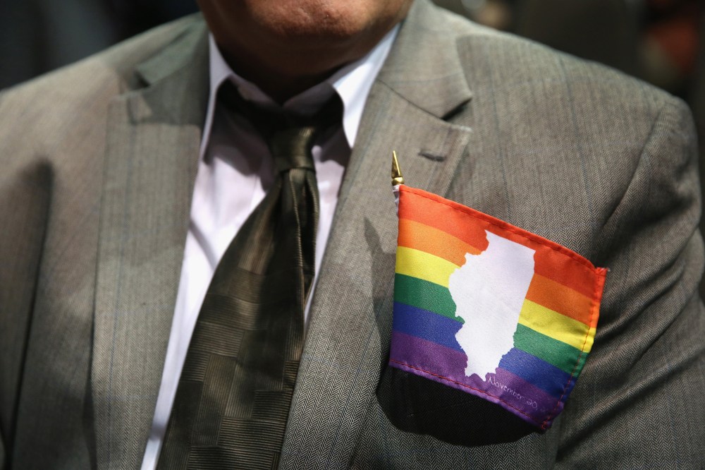 A supporter of gay marriage wears an Illinois gay pride flag on his jacket on Nov. 20, 2013 in Chicago, Ill.