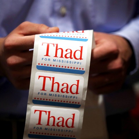 A campaign worker for U.S. Sen Thad Cochran (R-MS) passes out campaign stickers on June 23, 2014 in Jackson, Mississippi.
