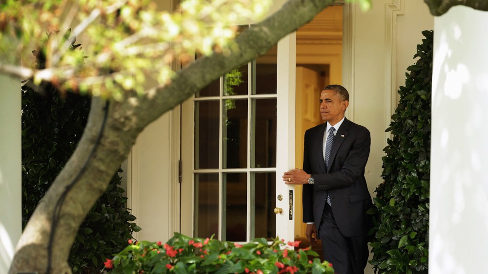 President Barack Obama steps out of the Oval Office as he departs the White House June 26, 2014 in Washington, DC.