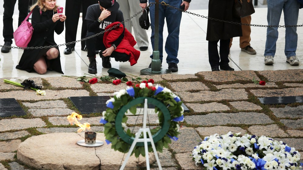 People visit the gravesite of former U.S. President John F. Kennedy at Arlington National Cemetery Nov, 22, 2013.