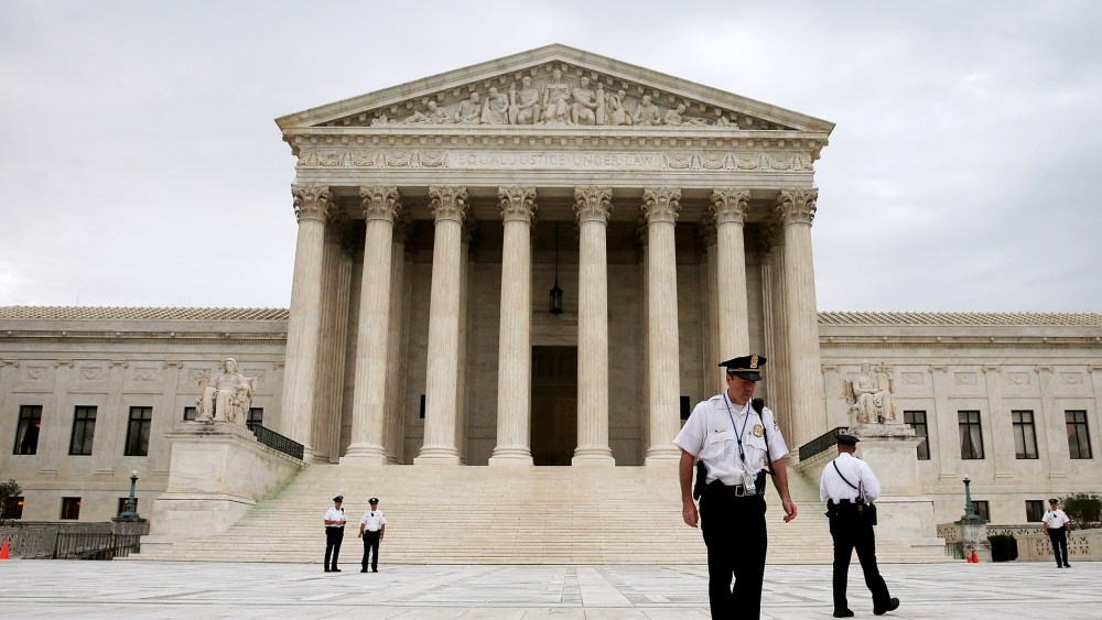 Police stand in front of the U.S. Supreme Court on June 30, 2014 in Washington, DC.