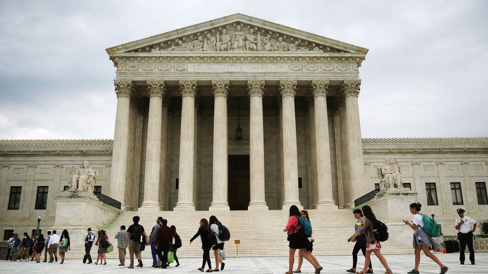 People arrive to attend the final session of the term at the U.S. Supreme Court on June 30, 2014 in Washington, DC.