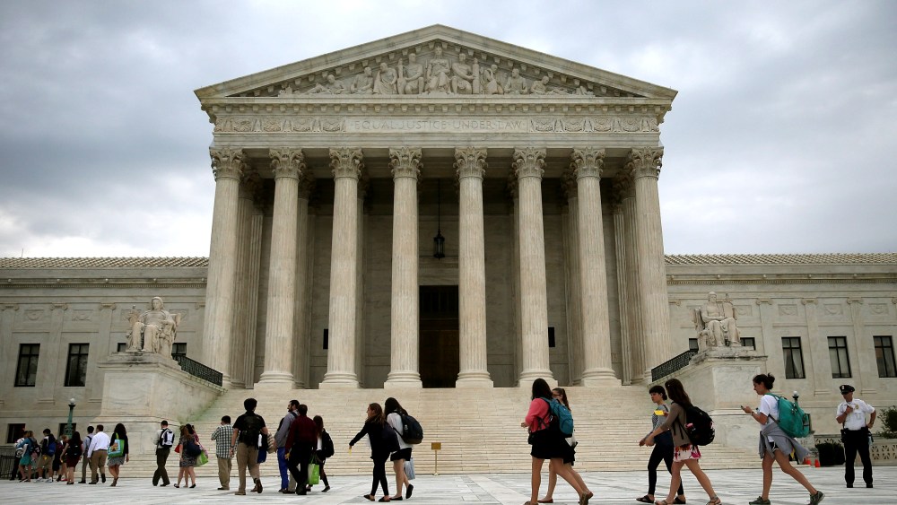 People arrive to attend the final session of the term at the U.S. Supreme Court on June 30, 2014 in Washington, DC.