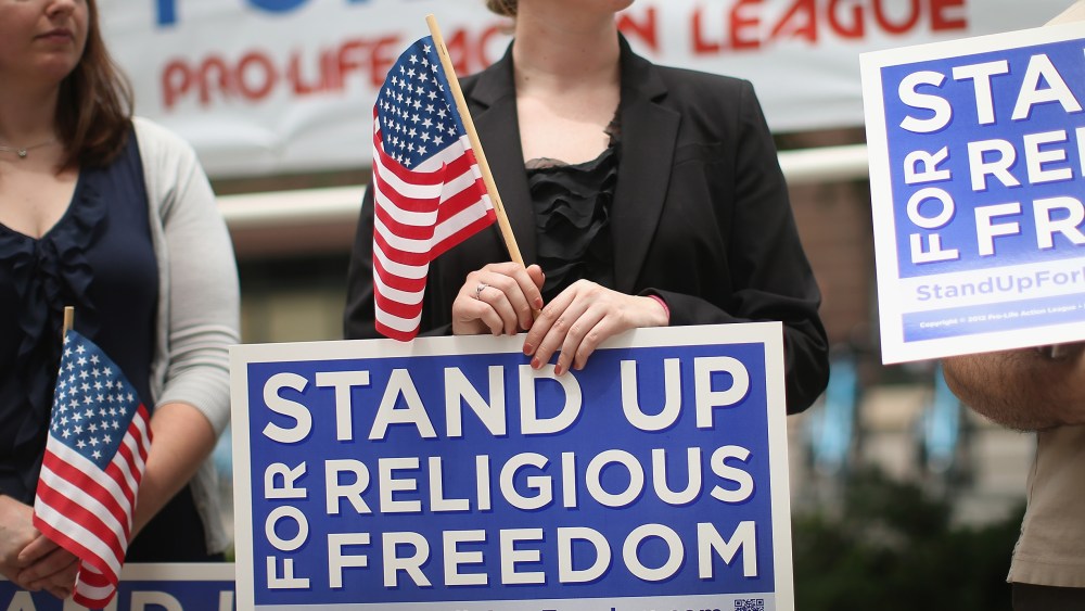 Religious freedom supporters hold a rally to praise the Supreme Court's decision in the Hobby Lobby contraception coverage requirement case on June 30, 2014 in Chicago, Ill. (Scott Olson/Getty)