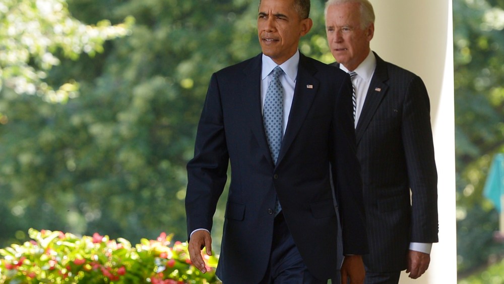 US President Barack Obama and Vice President Joe Biden make their way to the Rose Garden to speaks on immigration reform on June 30, 2014 at the White House in Washington, DC.
