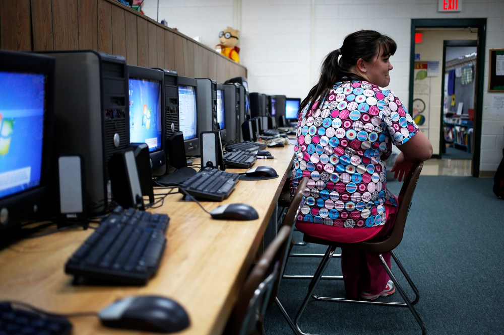 Kentucky health care exchange navigator Courtney Lively waits for enrollees to show up, November 20, 2013.