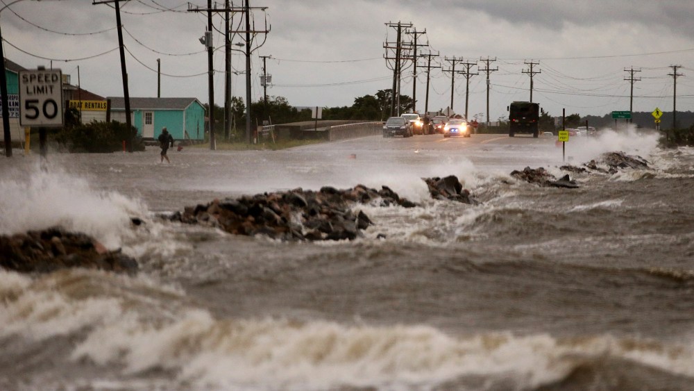 Strong winds and heavy surf cover Hwy 64 at the Albemarle Sound caused by Hurricane Arthur on July 3, 2014 in Nags Head, North Carolina.