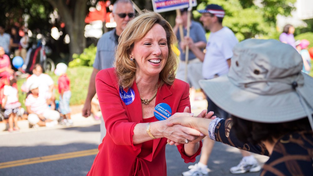 Barbara Comstock, Republican candidate for Virginia's 10th Congressional District, greets attendees of Leesburg's Independence Day parade, July 4, 2014, in Leesburg, Va. (Photo By Tom Williams/CQ Roll Call/Getty)