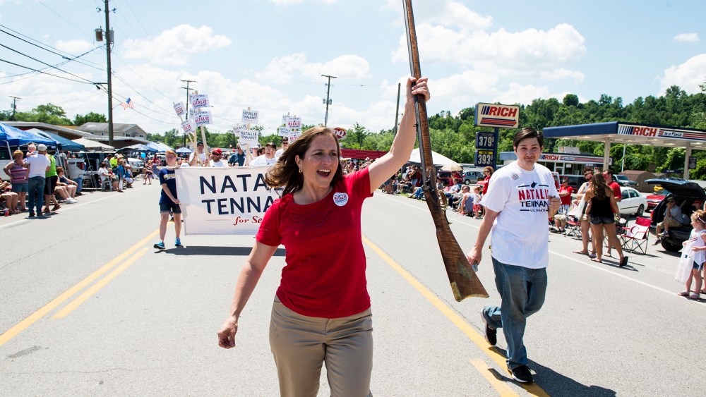 U.S. Senate candidate West Virginia Secretary of State Natalie Tennant marches with her musket in the Ripley 4th of July Parade in Ripley, W. Va., on July 4, 2014.