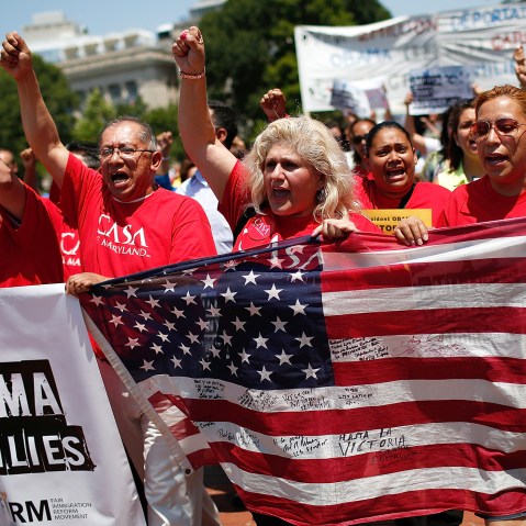 Immigration reform protesters march during an immigration rally July 7, 2014 in Washington, D.C. (Photo by Win McNamee/Getty)