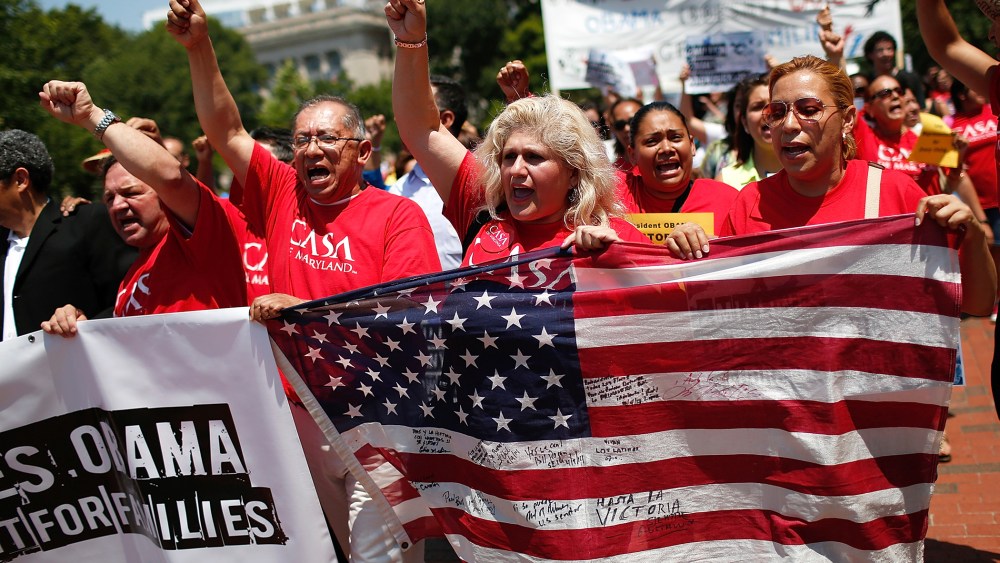 Immigration reform protesters march during an immigration rally July 7, 2014 in Washington, D.C. (Photo by Win McNamee/Getty)