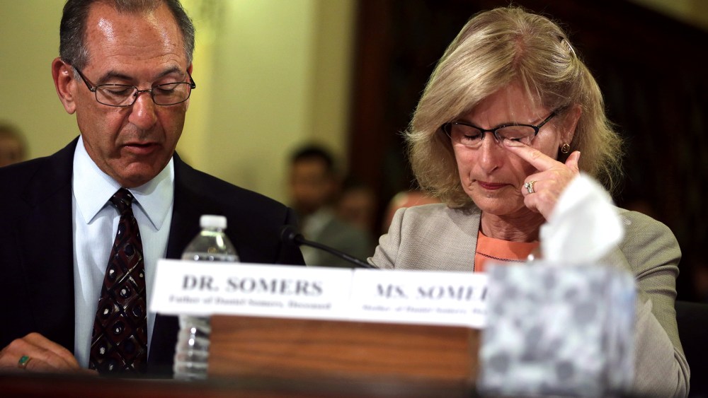 Jean Somers (R), whose son Daniel took his own life after he returned from a second deployment in Iraq, wipes tears during a hearing on Capitol Hill in Washington, DC.