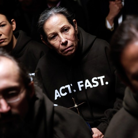 Supporters of immigration reform listen during a Fast for Families press conference in Washington, DC., Nov. 26, 2013.