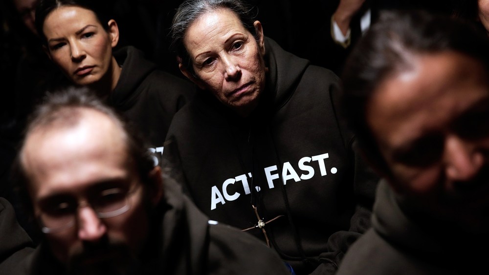 Supporters of immigration reform listen during a Fast for Families press conference in Washington, DC., Nov. 26, 2013.
