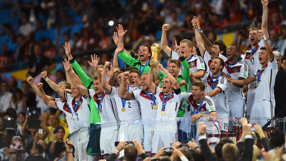 Philipp Lahm of Germany lifts the World Cup trophy after defeating Argentina 1-0 in extra time during the 2014 FIFA World Cup Brazil Final match between Germany and Argentina at Maracana on July 13, 2014 in Rio de Janeiro, Brazil. (Matthias Hangst/Getty)