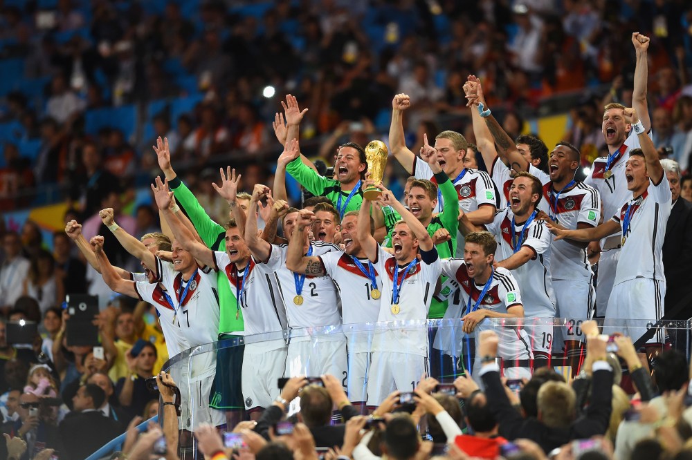 Philipp Lahm of Germany lifts the World Cup trophy after defeating Argentina 1-0 in extra time during the 2014 FIFA World Cup Brazil Final match between Germany and Argentina at Maracana on July 13, 2014 in Rio de Janeiro, Brazil. (Matthias Hangst/Getty)