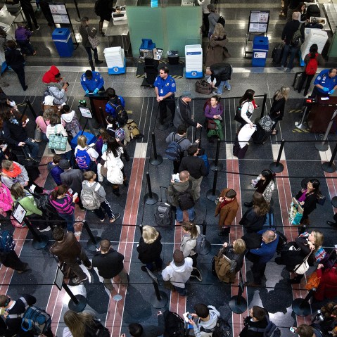 Holiday travelers line up for one of the TSA security checkpoints at Ronald Reagan National Airport (DCA) in Washington on November 26, 2013. (Photo by Paul J. Richards/AFP/Getty)