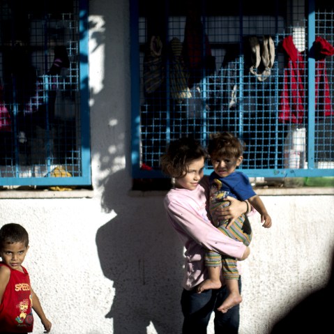 Palestinian children take refuge at a UN school after evacuating their homes near the border at the Jabaliya refugee camp in the Gaza Strip on July 15, 2014.