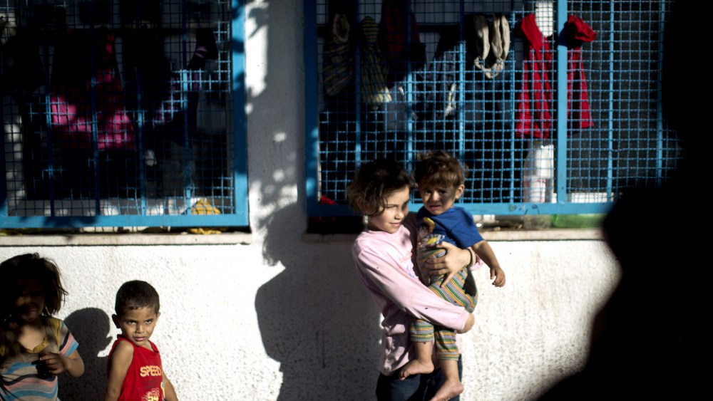 Palestinian children take refuge at a UN school after evacuating their homes near the border at the Jabaliya refugee camp in the Gaza Strip on July 15, 2014.