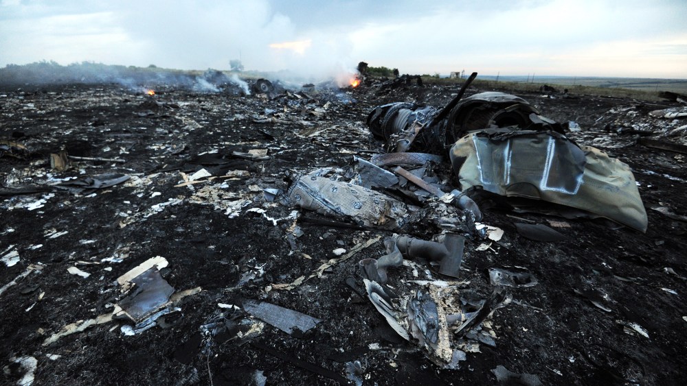 Flames are shown amongst the wreckages of the Malaysia Airlines flight carrying 298 people from Amsterdam to Kuala Lumpur after it crashed, near the town of Shaktarsk, in rebel-held east Ukraine, July 17, 2014.