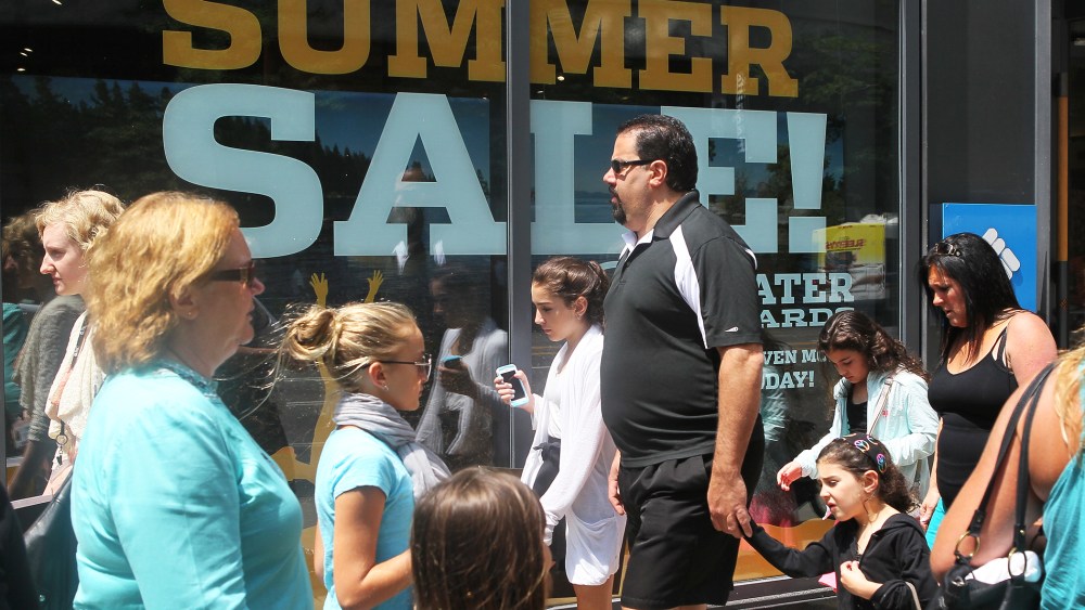 Shoppers visit stores along a section of Michigan Avenue, July 29, 2014 in Chicago, Illinois.