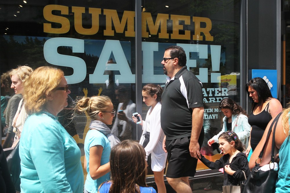 Shoppers visit stores along a section of Michigan Avenue, July 29, 2014 in Chicago, Illinois.