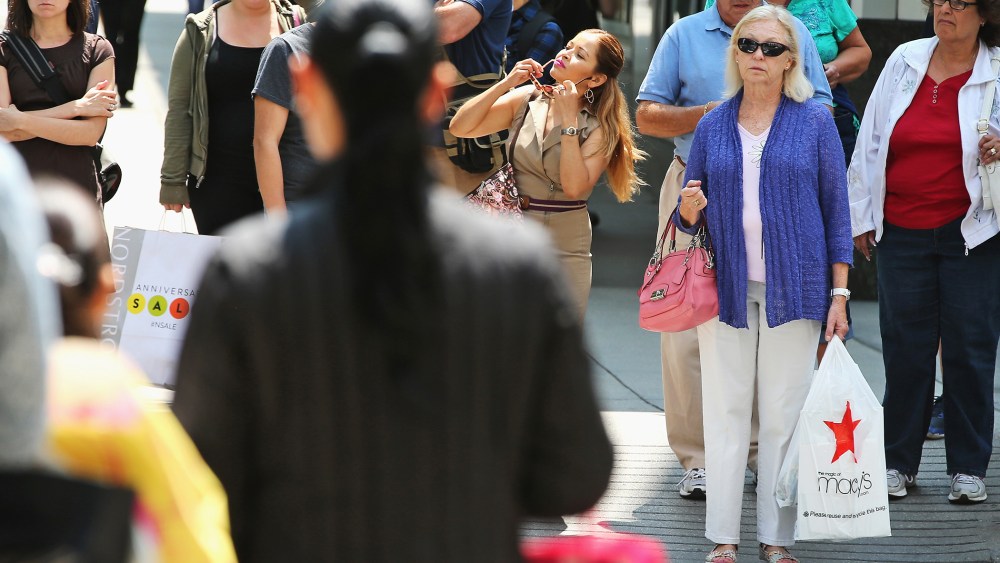Shoppers visit stores along a section of Michigan Avenue on July 29, 2014 in Chicago, Illinois.