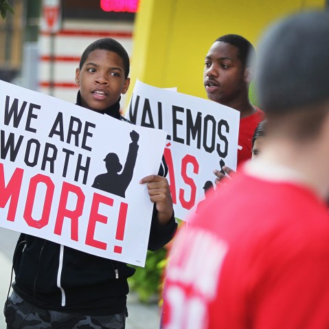 Fast food workers and activists demonstrate outside McDonald's downtown flagship restaurant on July 31, 2014 in Chicago, Illinois.