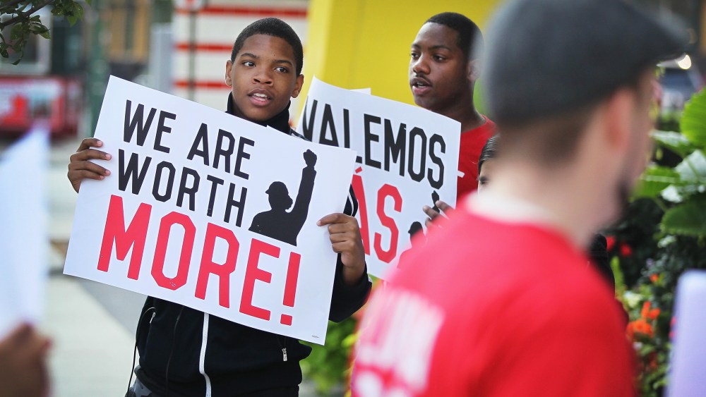 Fast food workers and activists demonstrate outside McDonald's downtown flagship restaurant on July 31, 2014 in Chicago, Ill.