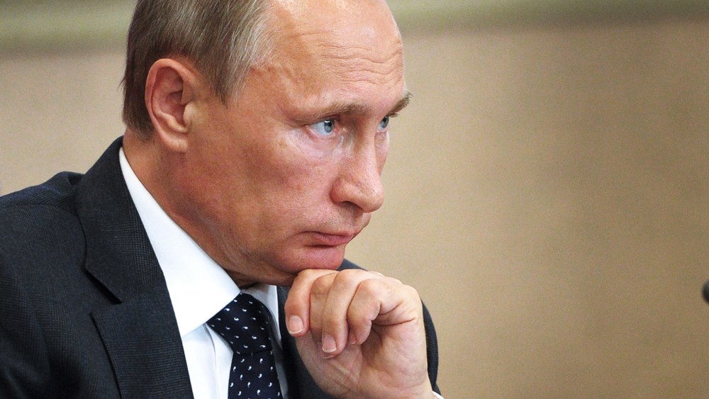 Russian President Vladimir Putin attends a local administration meeting as he visits Voronezh, Russia on Aug. 5, 2014. (Photo by Alexey Druzhinin/AFP/Getty)