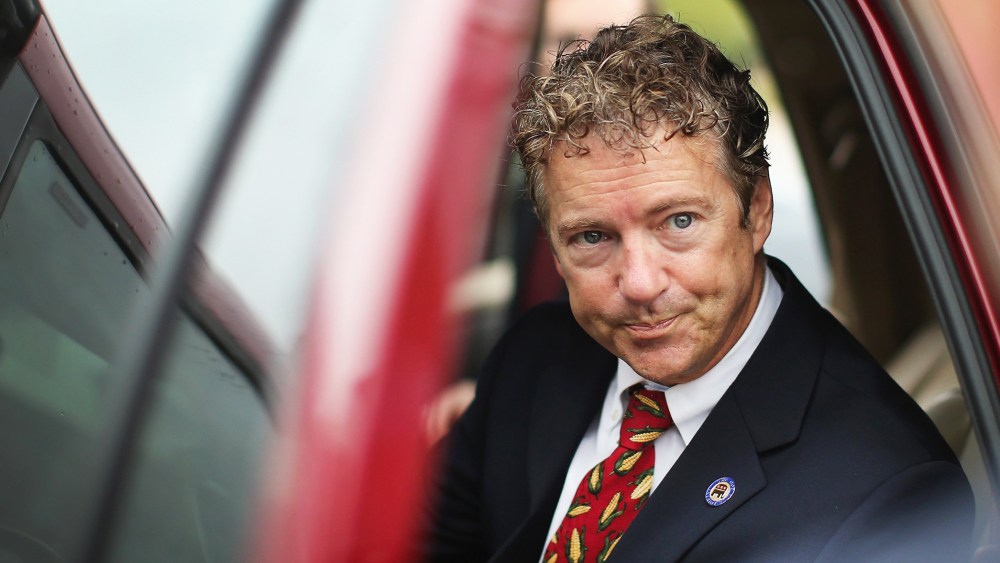 U.S. Sen. Rand Paul (R-KY) is questioned by a reporter as he leaves an event at the Iowa GOP Des Moines Victory Office on August 6, 2014 in Urbandale, Iowa.