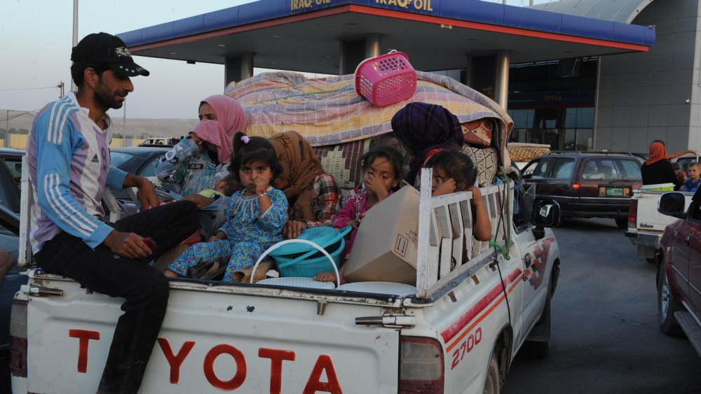 Thousands of Yazidi and Christian people flee Mosul to Erbil after the latest wave of ISIL advances that began on Sunday has seen a number of towns near Iraq's second largest city fall to the militants on August 6, 2014.