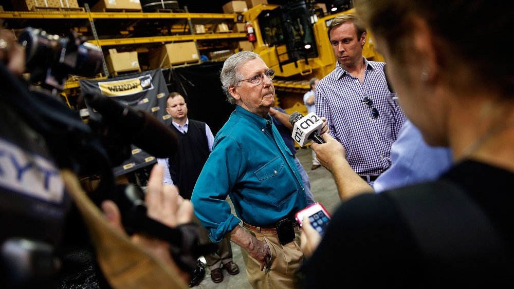 Senate Minority Leader Mitch McConnell (R-Ky.) takes questions from members of the press after speaking at Whayne Supply headquarters while campaigning during a two day bus tour of eastern Kentucky Aug. 7, 2014 in Corbin, Ky.