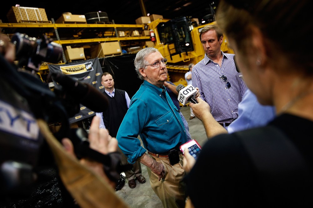 Senate Minority Leader Mitch McConnell (R-Ky.) takes questions from members of the press after speaking at Whayne Supply headquarters while campaigning during a two day bus tour of eastern Kentucky Aug. 7, 2014 in Corbin, Ky.