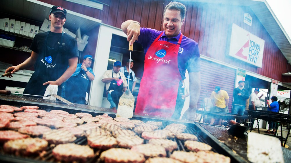 Senate candidate Rep. Bruce Braley, D-Iowa, helps out on the grill in the Pork Tent at the Iowa State Fair in Des Moines, August 7, 2014.