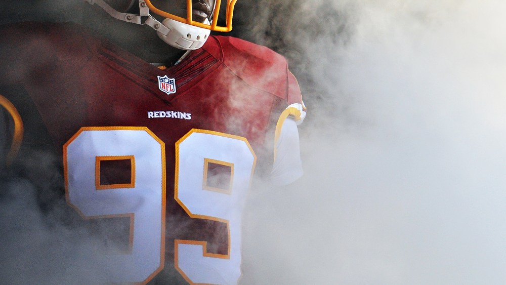 A player on the Washington Redskins waits to be introduced before playing during a preseason NFL game on Aug. 7, 2014 in Landover, Md.