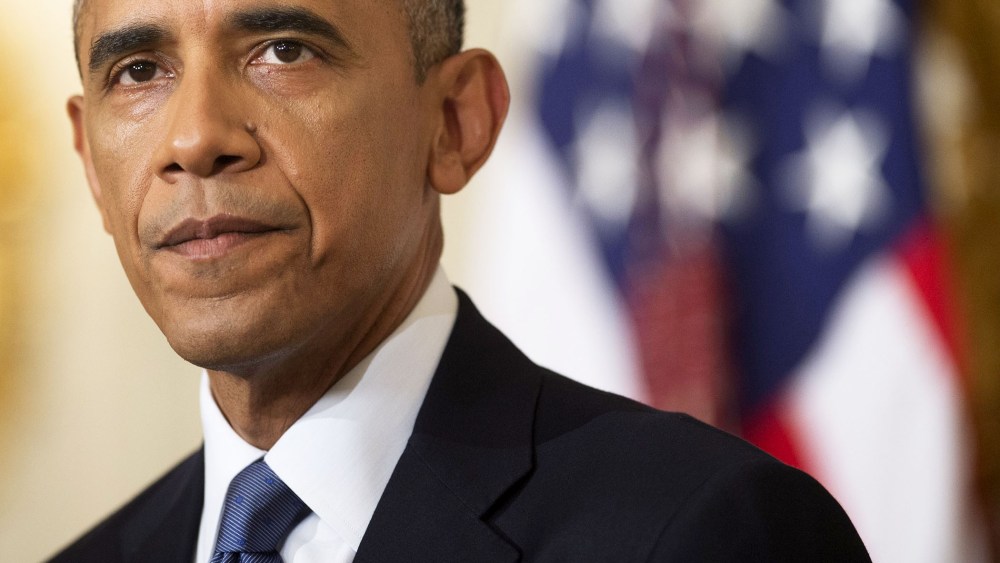 US President Barack Obama speaks in the State Dining Room at the White House, August 7, 2014.