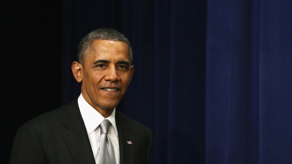 U.S. President Barack Obama arrives for a statement on the Affordable Care Act December 3, 2013 in the South Court Auditorium at the Eisenhower Executive Office Building in Washington, D.C.