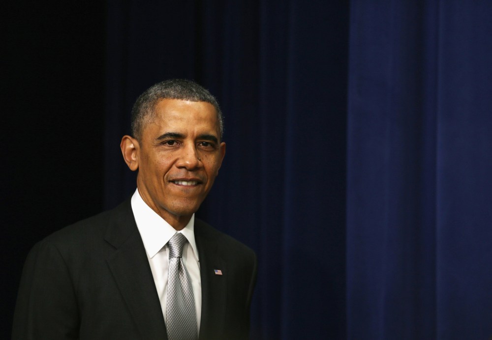 U.S. President Barack Obama arrives for a statement on the Affordable Care Act December 3, 2013 in the South Court Auditorium at the Eisenhower Executive Office Building in Washington, D.C.