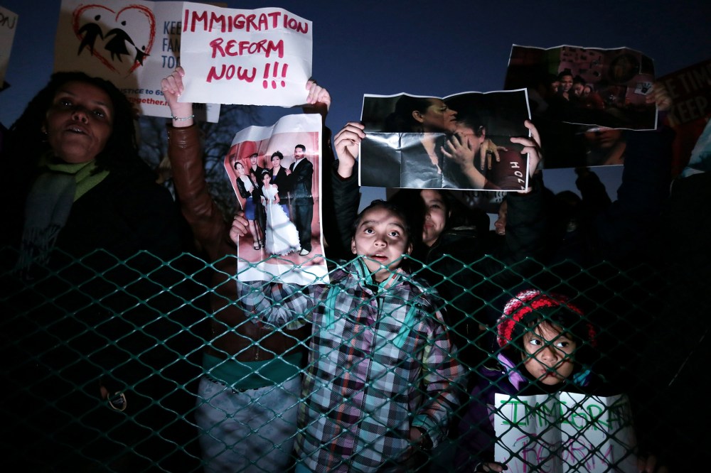 Immigration reform proponents demonstrate during the U.S. Capitol Christmas Tree lighting ceremony on Dec. 3, 2013 in Washington, DC.
