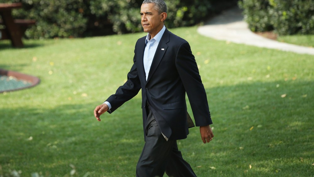 President Barack Obama walks out of the White House before making a statement on the South Lawn of the White House on Aug. 9, 2014 in Washington, D.C.