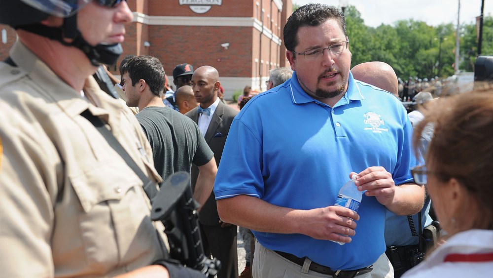 Ferguson Mayor James Knowles III (C) speaks to protestors during a protest of the shooting death of 18-year-old Michael Brown by a Ferguson police officer, outside Ferguson Police Department Headquarters Aug. 11, 2014 in Ferguson, Mo.