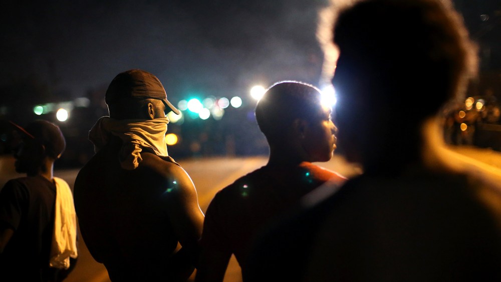 Demonstrators protest the killing of teenager Michael Brown on Aug. 12, 2014 in Ferguson, Mo.