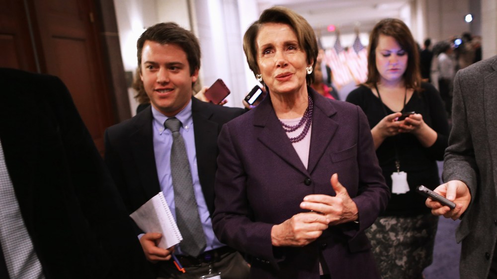 House Minority Leader Nancy Pelosi talks with reporters, Dec. 5, 2013.